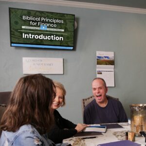 Three people meeting and watching the Biblical Finance course together.